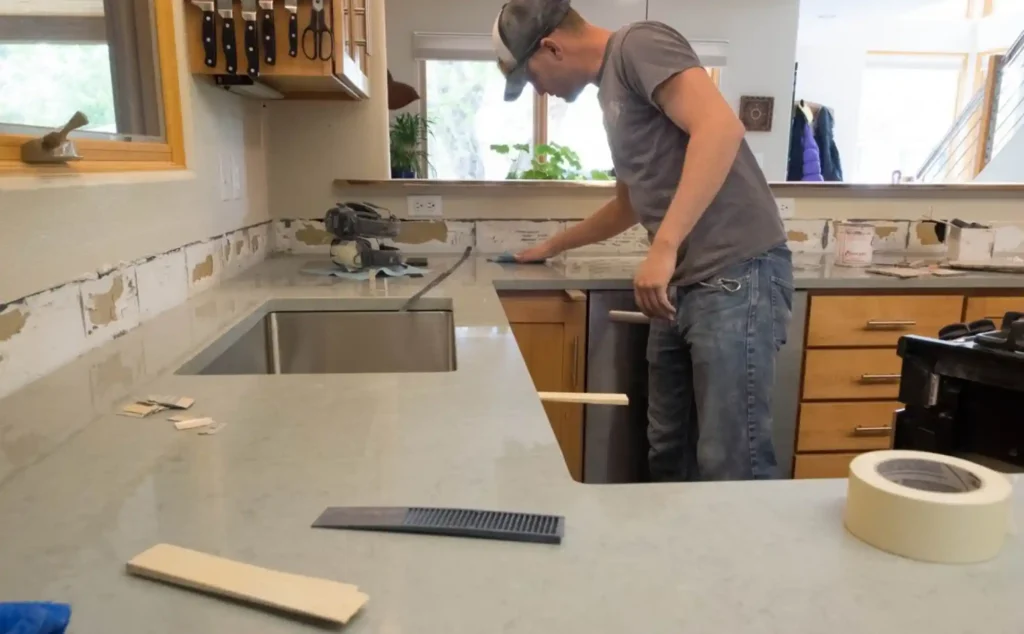 Image depicting the use of improper tools during the marble sealing process, leading to surface damage.